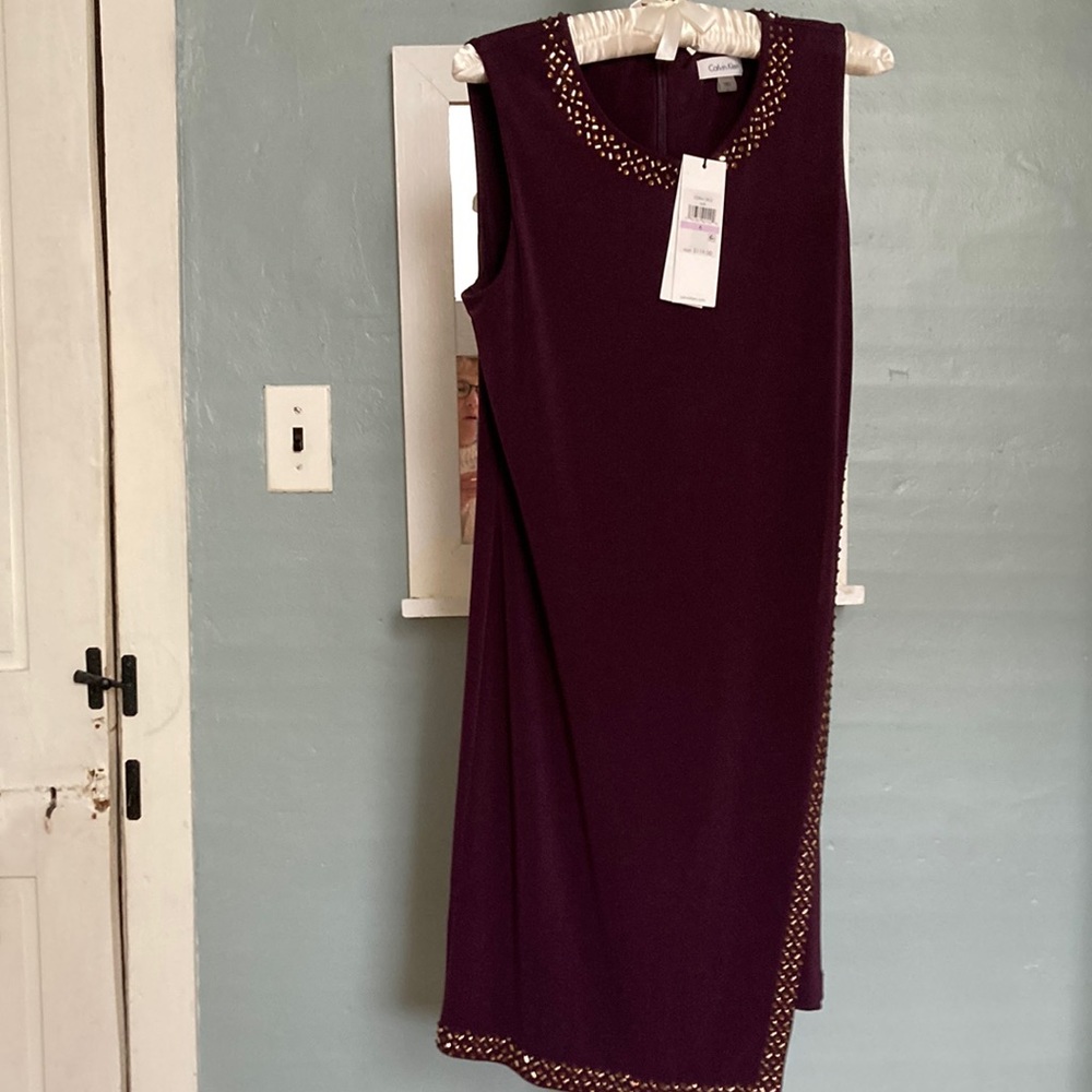 Brand New Calvin Klein deep colored plum dress w/ beading around neckline. Sz 6